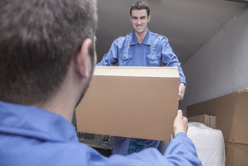 Professional movers assisting with packing in Mile End