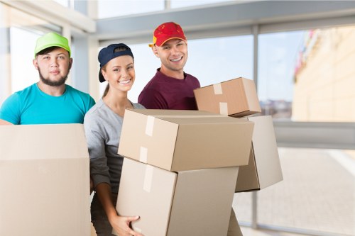 Professional movers loading a truck in The Hyde