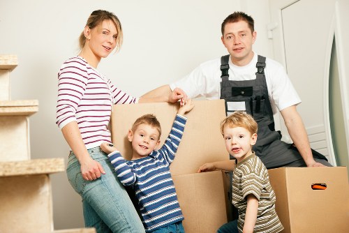 Professional movers handling large furniture