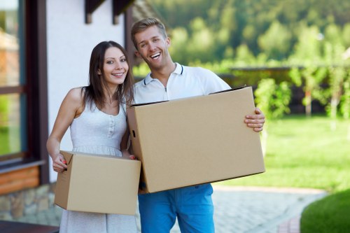 Professional movers assisting with a residential move in Ponders End