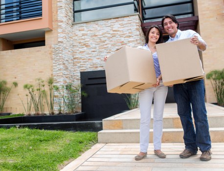 Professional movers assisting a family